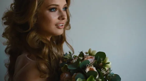 Beautiful bride posing near the window Stock Footage 68402261