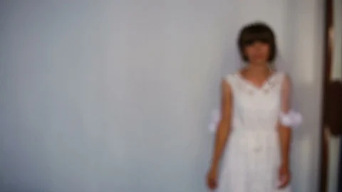 Beautiful bride posing near the window holding bouquet. Bride's morning. Stock Footage 95560007