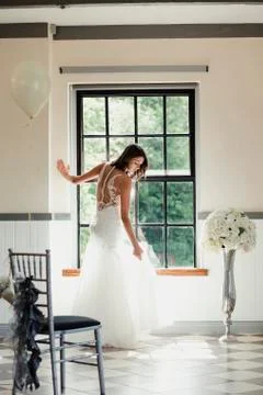 Beautiful Bride Posing At The Window 스톡 사진