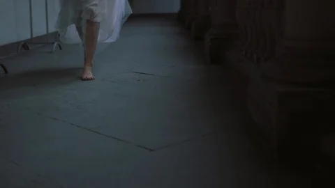 Beautiful bride runs between the columns. Italian architecture. Beautiful Stock Footage 103867223
