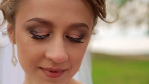 Beautiful bride with shrewd glance Stock Footage 75025834