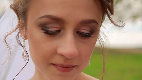 Beautiful bride with shrewd glance Stock Footage 75025908