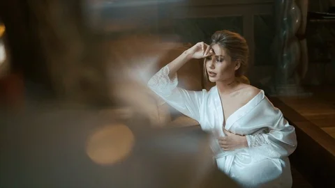 Beautiful Bride Is Sitting On The Couch. Video stock 106094056