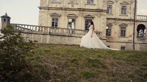 Beautiful Bride Walking Before Castle 库存影片 71065946