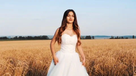 Beautiful bride in wheat field on sunset Stock Footage 112119271