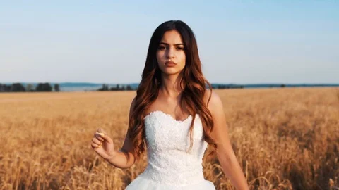 Beautiful bride in wheat field on sunset Stock Footage 112119324