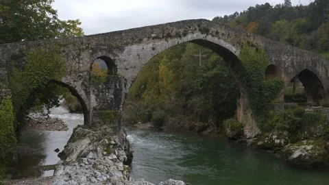 Beautiful bridge in Cangas de Onis near Picos de Europa mountains, in Spain Stock Footage 148580175