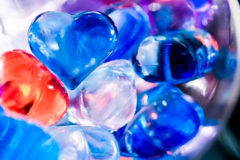 Beautiful bright background from decorative multi-colored hearts. Festive ima 스톡 사진