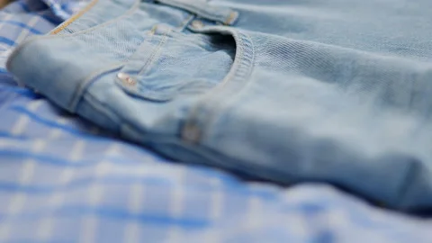 Beautiful bright blue jeans texture background, Denim gathered. Smooth camer Stock Footage 233512573
