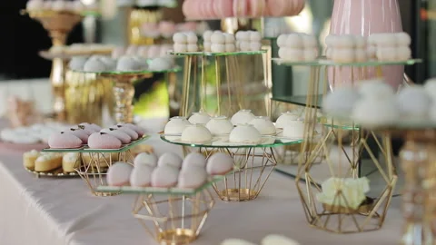 Beautiful bright buffet with many sweet snacks a candy bar on a white table and Stock Footage 196004783