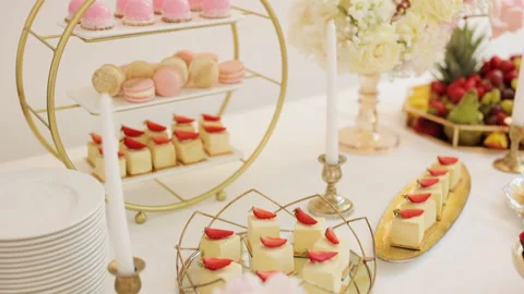 Beautiful bright buffet with many sweet snacks a candy bar on a white table and Video stock 196005370