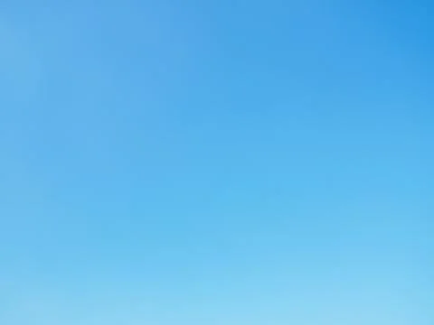 Beautiful bright light blue sky background in sunny day Stock Photos