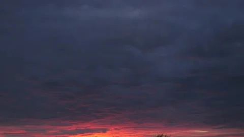 Beautiful bright red sunset with cloudscape timelapse Stock Footage 145954901