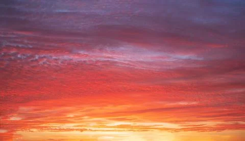 Beautiful bright sunset with multi-colored dramatic clouds Stock Photos