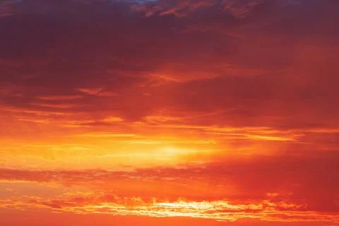 Beautiful bright sunset with multi-colored dramatic clouds Stock Photos
