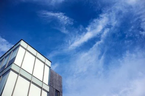 Beautiful brilliant and dynamic cloudscape over modern building Stock Photos