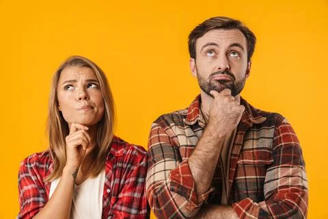 Beautiful brooding couple thinking and looking upward Stock Photos