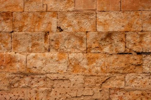 Beautiful brown wall with rectangular stones Stock Photos