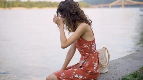 Beautiful brunette eats burger Stock Footage 128384245