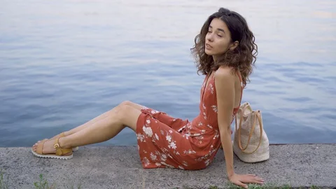 Beautiful brunette eats burger Stock Footage 128384268