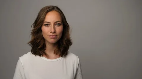 Beautiful brunette gesturing Stock Footage 86413070