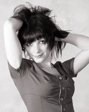 Beautiful brunette posing looking at the camera Stock Photos