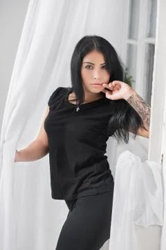 Beautiful brunette posing in the studio. Stock Photos