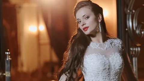 Beautiful Brunette Posing In White Bride's Dress. Stock Footage 108593948
