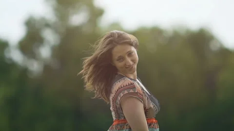 Beautiful brunette in rhythmic dance slow motion attractive female smile outdoor Stock Footage 96716728