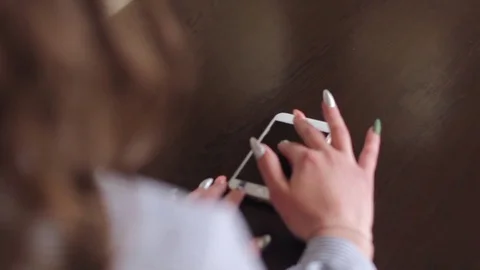 Beautiful brunette using cell phone and texting Stock Footage 74507911