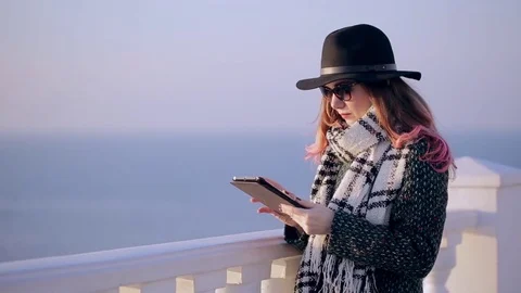 Beautiful brunette using digital tablet touch screen. Hipster girl with tablet Stock Footage 73970744