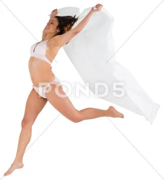 Beautiful brunette in white bikini holding towel Stock Photos