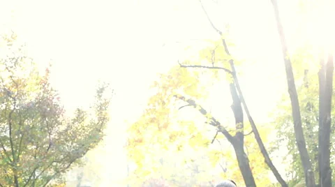 Beautiful brunette woman singing and man playing guitar in park Stock Footage 59556904