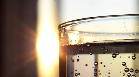 Beautiful Bubble Clear Water in Glass at Sunset Stock Footage 59087049