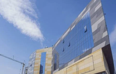 Beautiful building under construction in the form of the bow of the ship agai Stock Photos