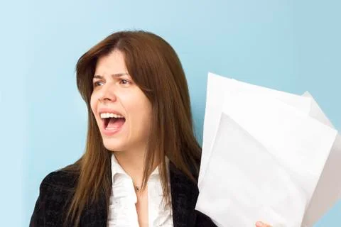 Beautiful business woman screaming and stressing over work Stock Photos