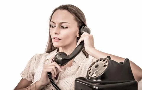 Beautiful business woman talking with a vintage phone Stock Photos