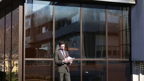 Beautiful businessman read notes Stock Footage 103455232