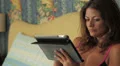 beautiful businesswoman in lingerie surfs in the internet with her tablet HD Footage