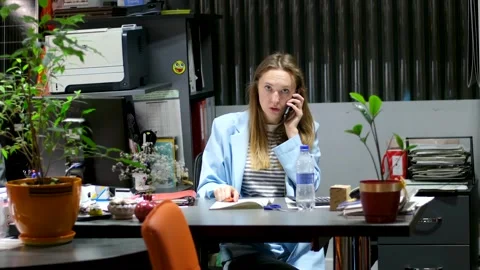 Beautiful businesswoman thinking of problem solution in office. Attractive young Stock Footage 253480063