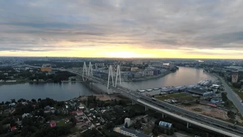 A beautiful cable-stayed bridge in the evening cityscape at sunset Vídeo Stock 319865463