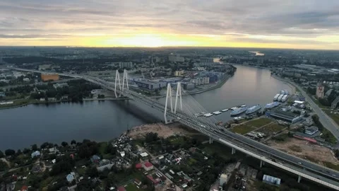 A beautiful cable-stayed bridge in the evening cityscape at sunset Stockbeeldmateriaal 319865519