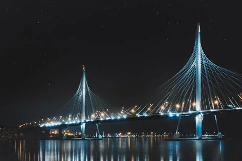 Beautiful cable-stayed bridge in St. Petersburg, Russia, with starry sky and Stock Photos