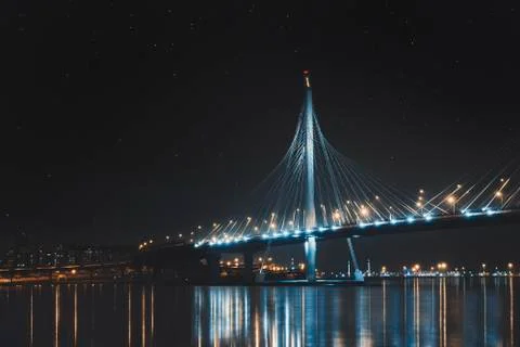 Beautiful cable-stayed bridge in St. Petersburg, Russia, with starry sky and Stock Photos