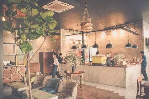 Beautiful cafe interior with tables and chairs and lighting Stock Photos