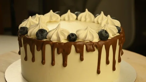 Beautiful cake spins on table Stock Footage 120401410