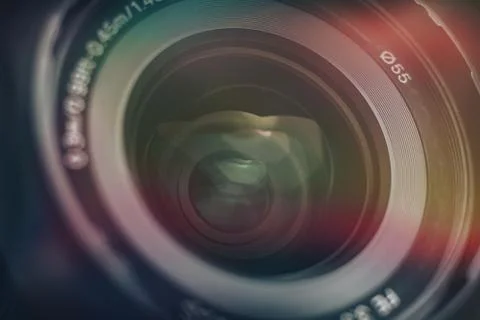 Beautiful camera lens with multi colored light of glass. Background pattern f Foto stock