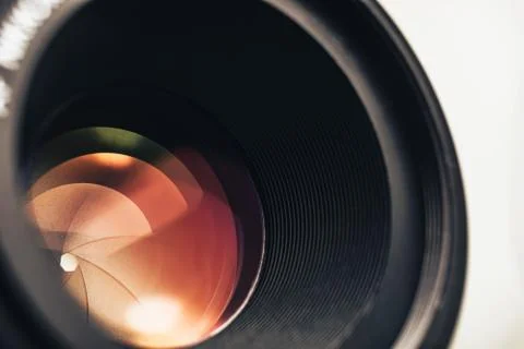 Beautiful camera lens with orange  light of glass. Background pattern for des Stock Photos