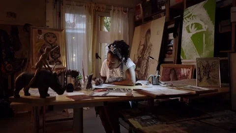 Beautiful camera movement of young African American girl painting in art stud Stock Footage 152344897