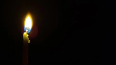 Beautiful Candle Flame in Darkness Stock Footage 317900957